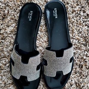 Silver and black flats.